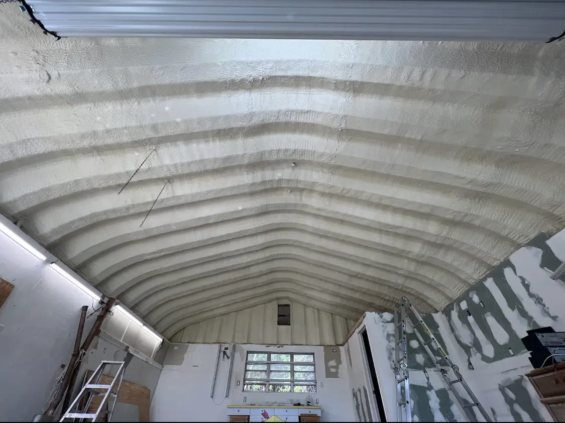 Spray polyurethane foam applied to the underside of a metal roof deck in Boylston